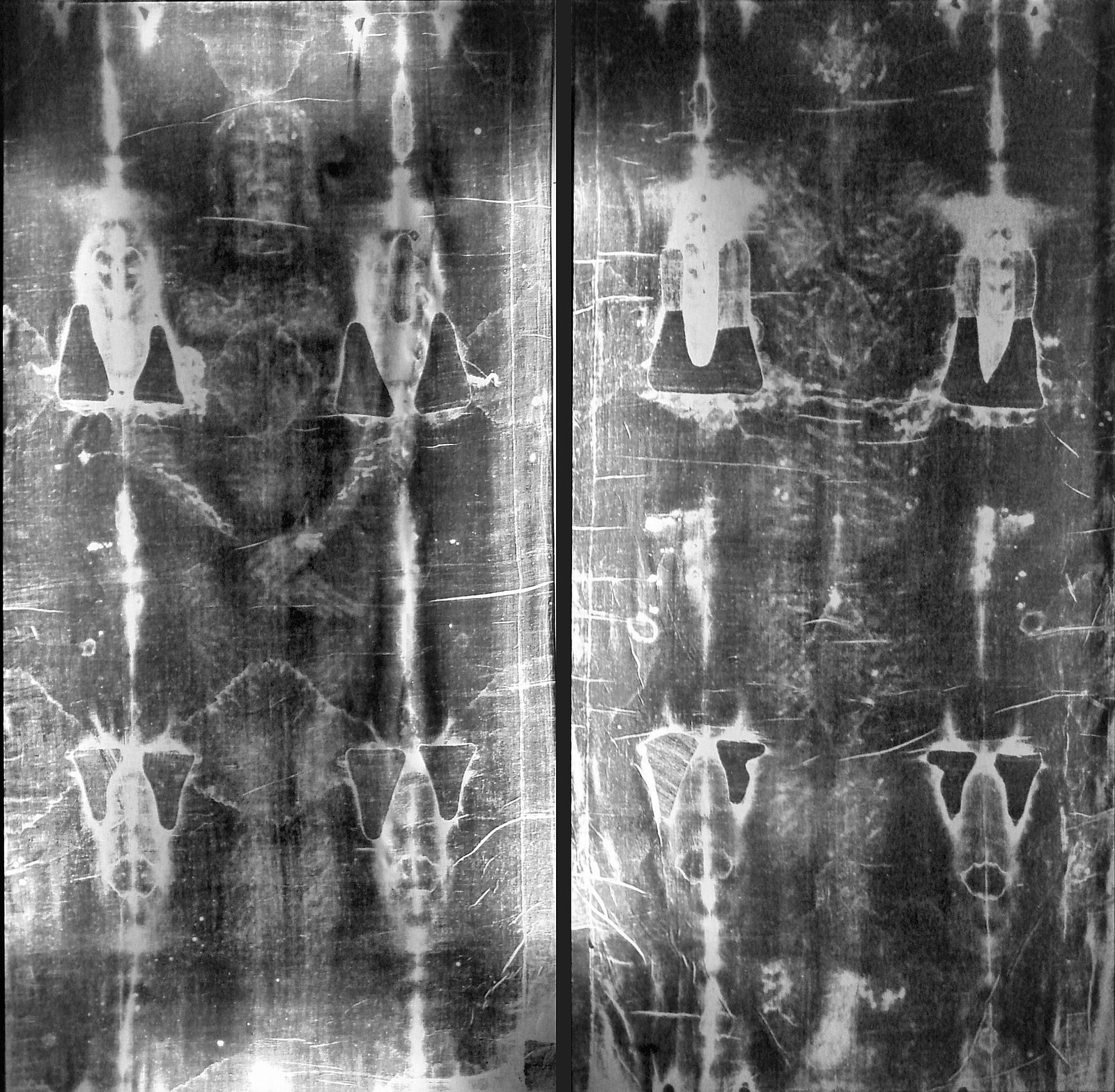 The full-length photographic negative of the Shroud of Turin (Giuseppe Enrie, 1931) — the frontal and dorsal images of the crucified man meeting head-to-head, with a blank, structured gap above the crown of the head