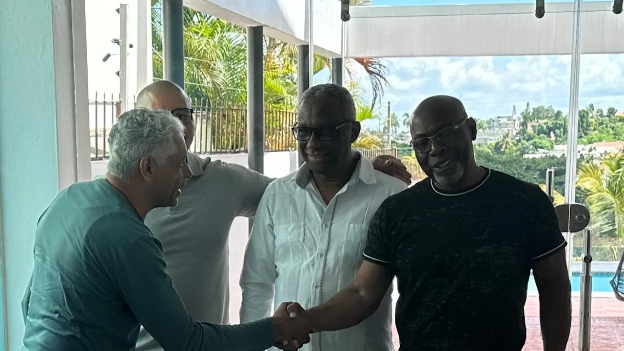 Minister Fredel greeting community leaders at his home in the Dominican Republic