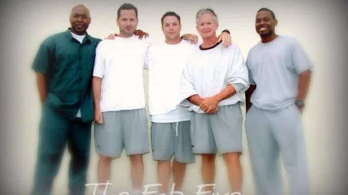 Five men standing together in a prison yard — “The Fab Five.”